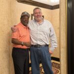 Eliam standing with Tito Fuentes