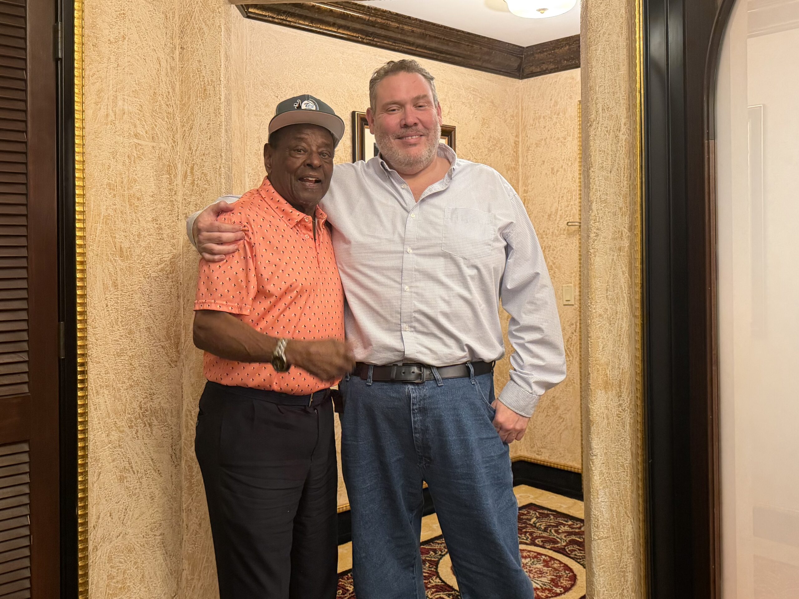 Eliam standing with Tito Fuentes