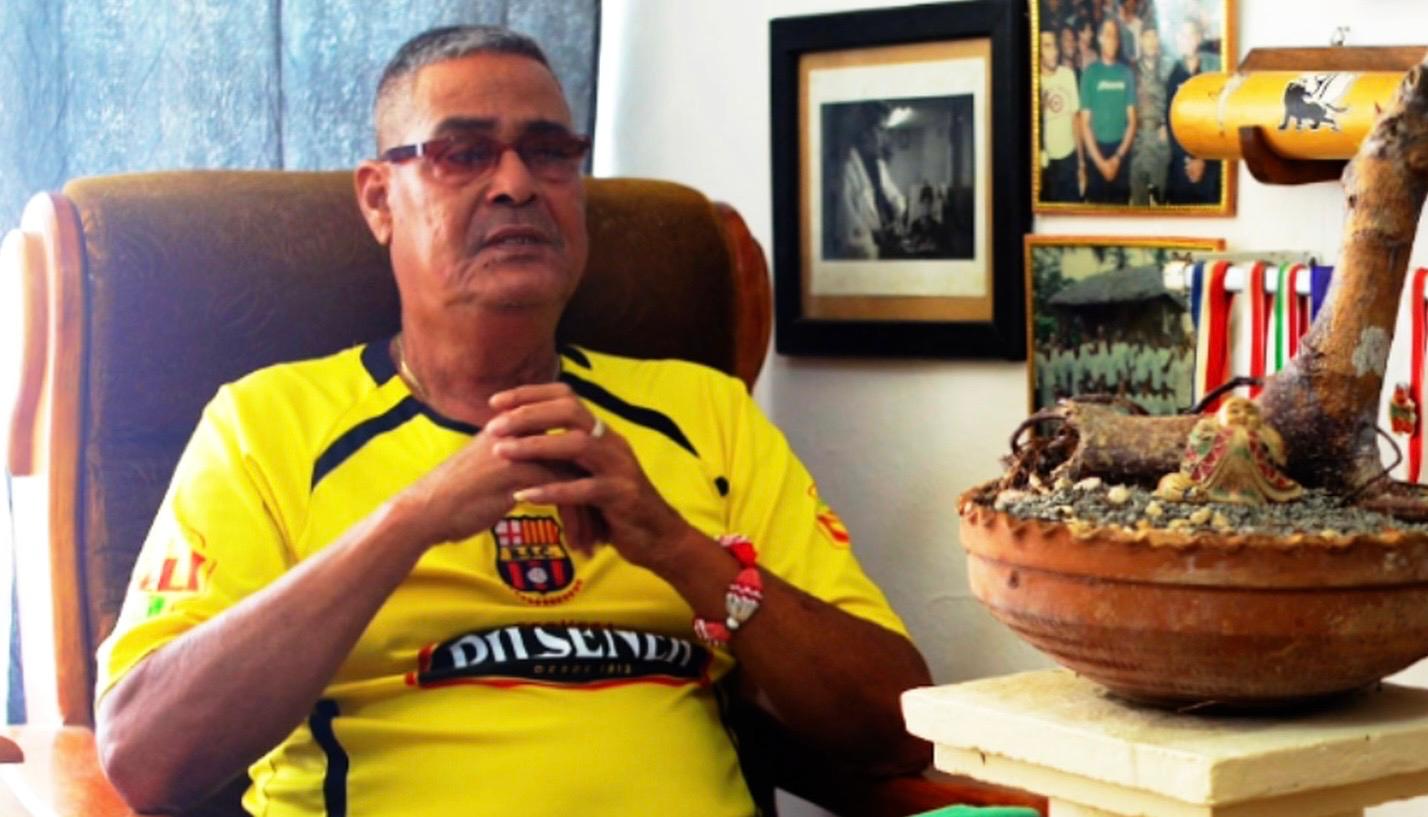 Lazaro Valle sitting with his hands crossed